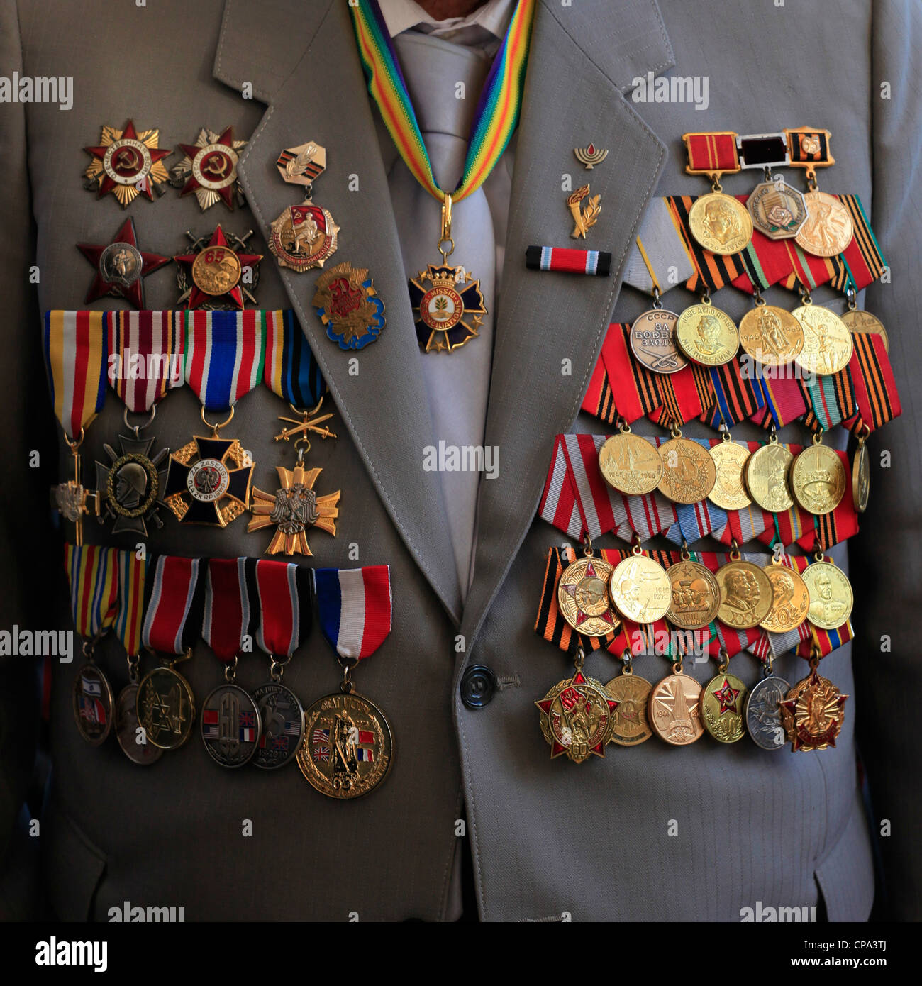 A soviet Jewish World War II veteran with medals pinned in his suit coat during ceremony marking the Allied Victory over Nazi Germany in Israel Stock Photo