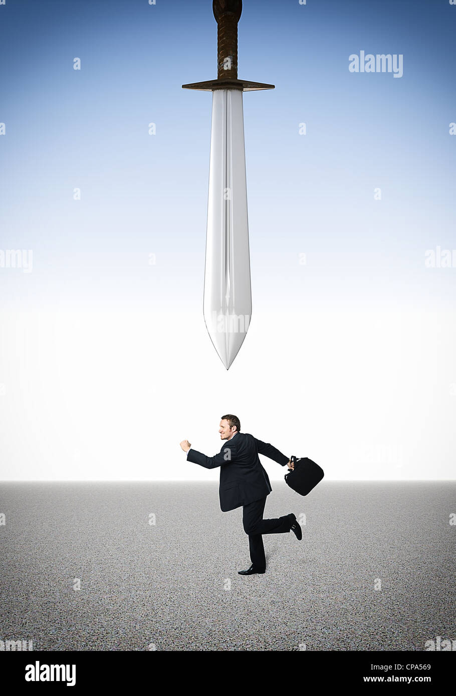 running businessman and damocles sword Stock Photo