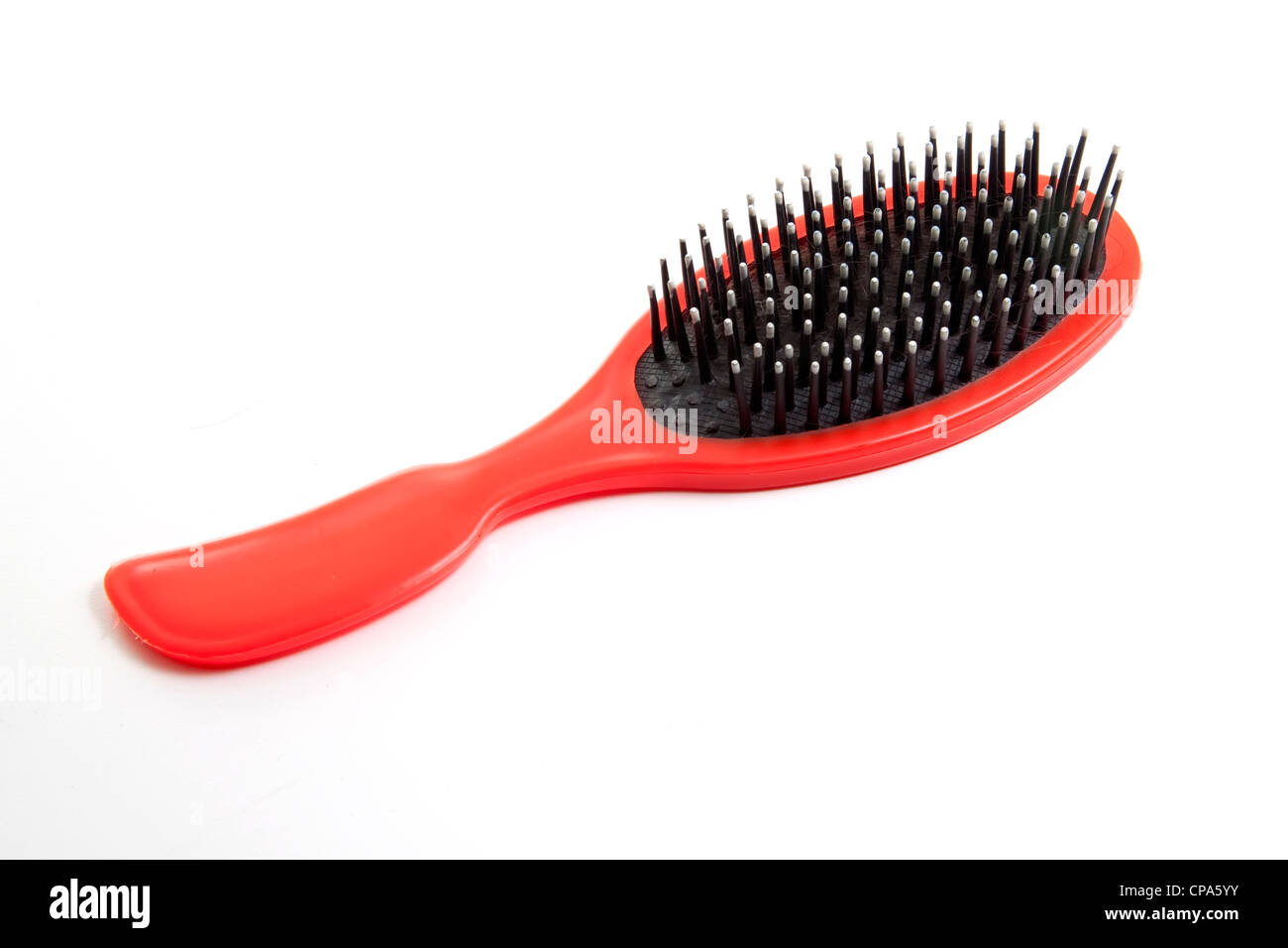 red brush with some hair Stock Photo