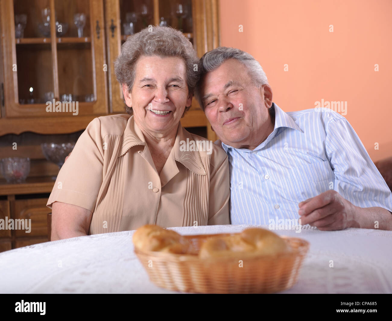 Happy grandfather sitting table hi-res stock photography and images - Alamy