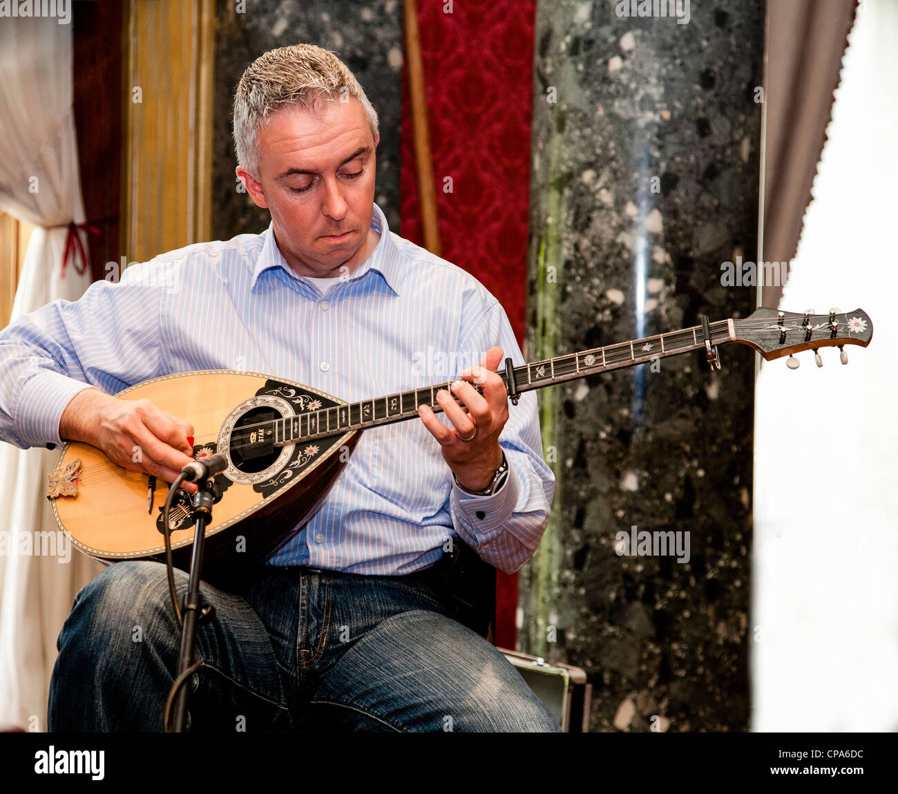 Mick Conneely playing bouzouki Stock Photo Alamy