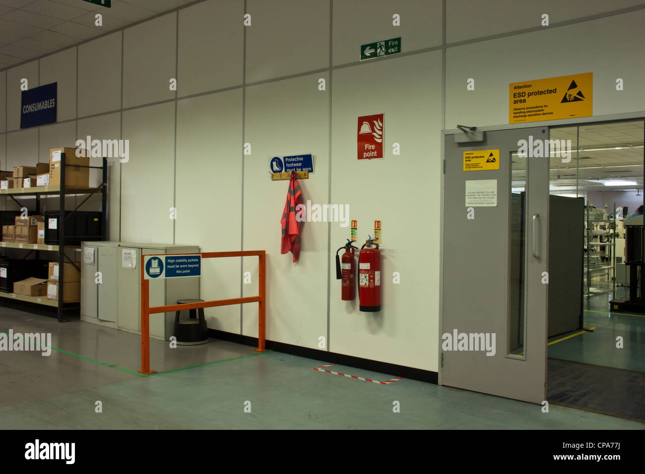 Warning notices in electronics factory manufacturing facility in UK. Stock Photo