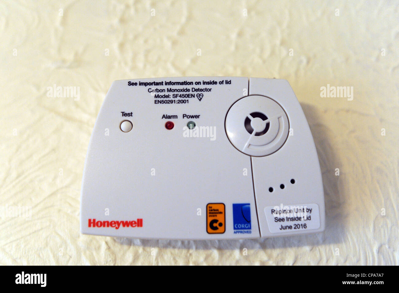 Honeywell Carbon Monoxide detector alarm attached to wall Stock Photo