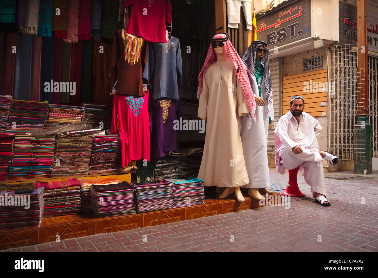 Arab Man Sitting Outside His Clothing Store Old Town Souk Dubai Stock Photo Alamy