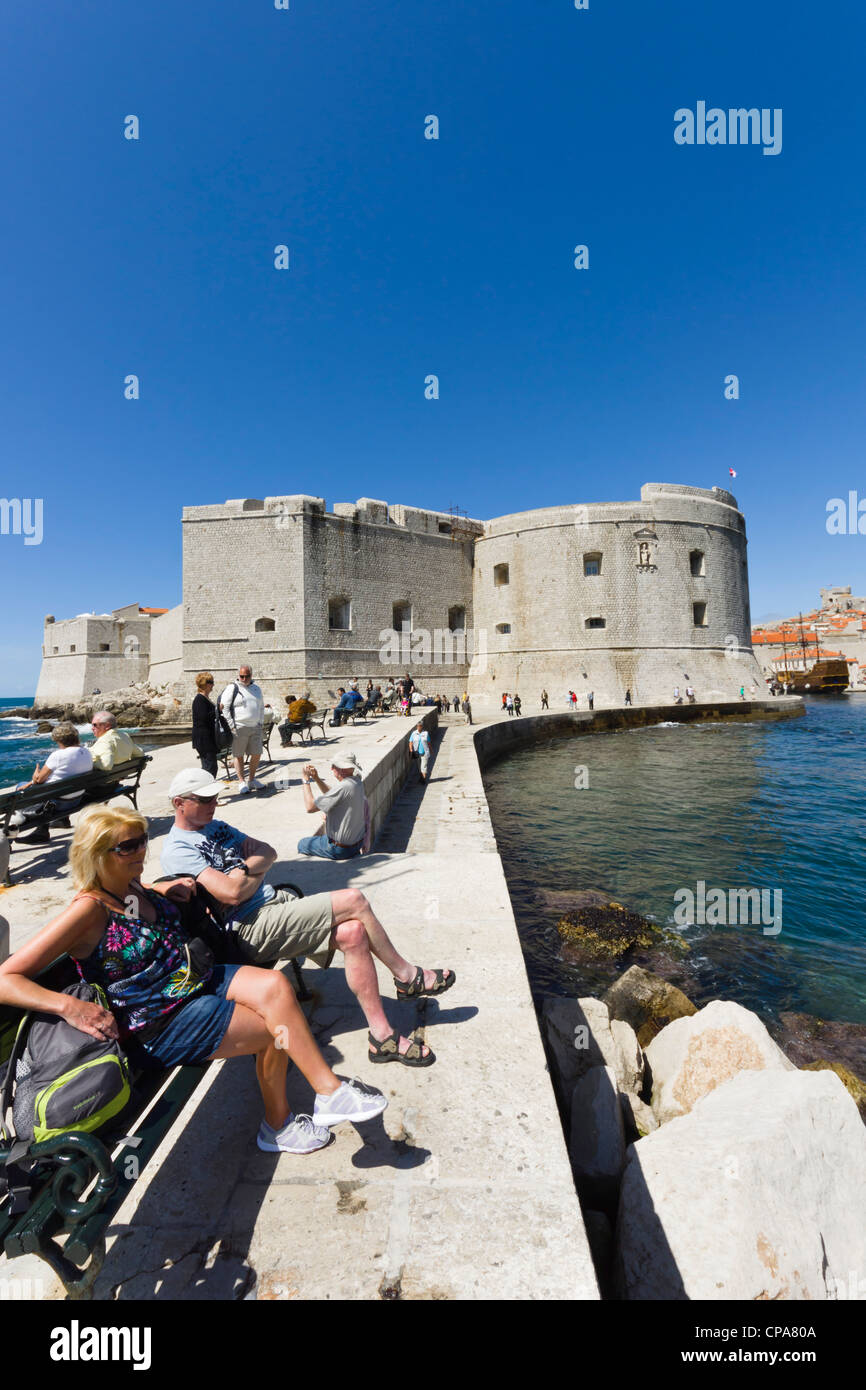 Dubrovnik, Croatia - the town walls and fortifications seen from the harbour jetty. St John Fortress. Stock Photo