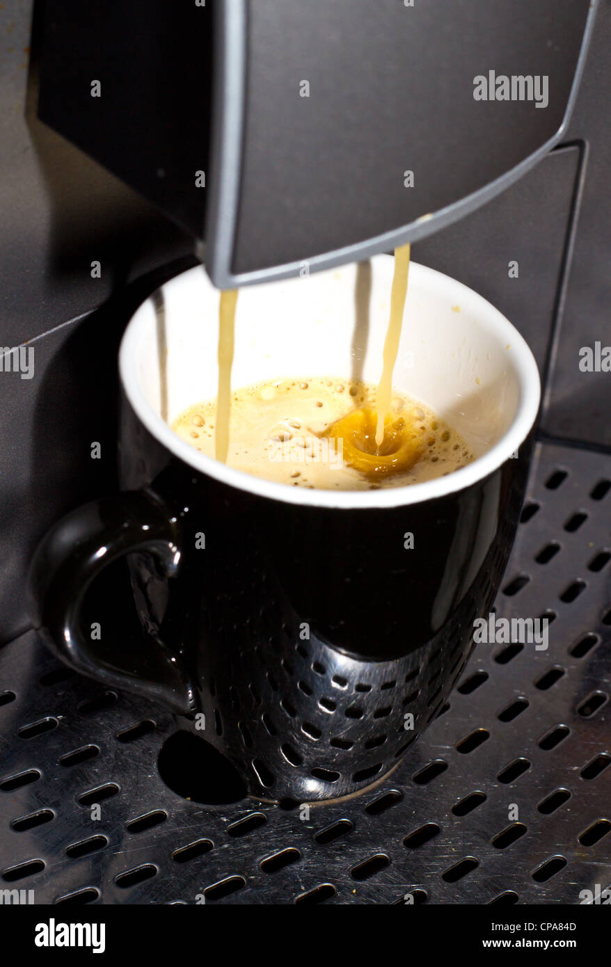 Black portable cappuccino maker on chrome stand frontal view isolated on  white background. The device for whipping cream for coffee - cappuccinatore  Stock Photo - Alamy