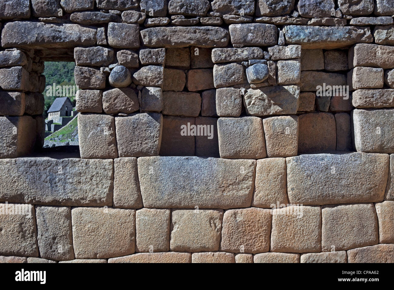 Stone wall detail with window and Niches at the ruins of Machu Picchu ...