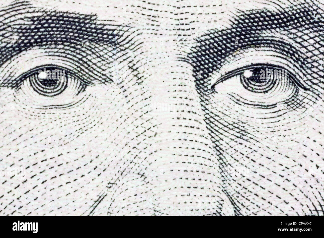 Extreme macro of Lincoln's eyes on the US five dollar bill. Stock Photo