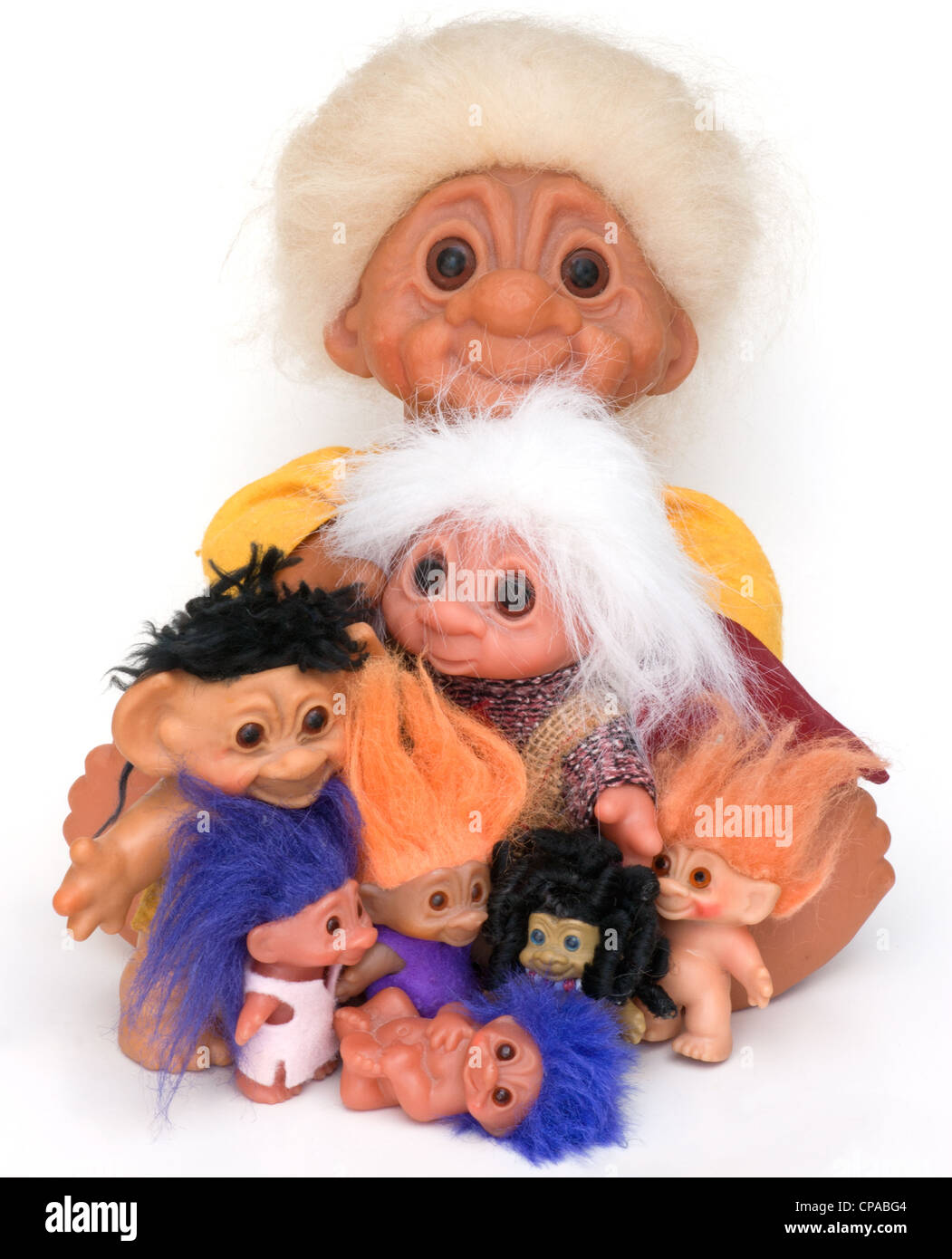 A collection or family of eight trolls or troll dolls all sizes and all colors. Stock Photo