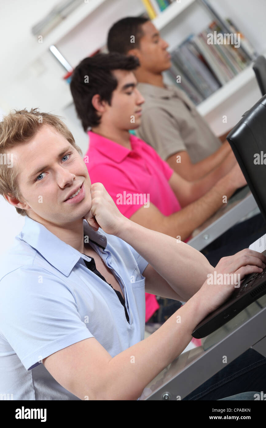 male students in class working on laptop Stock Photo - Alamy