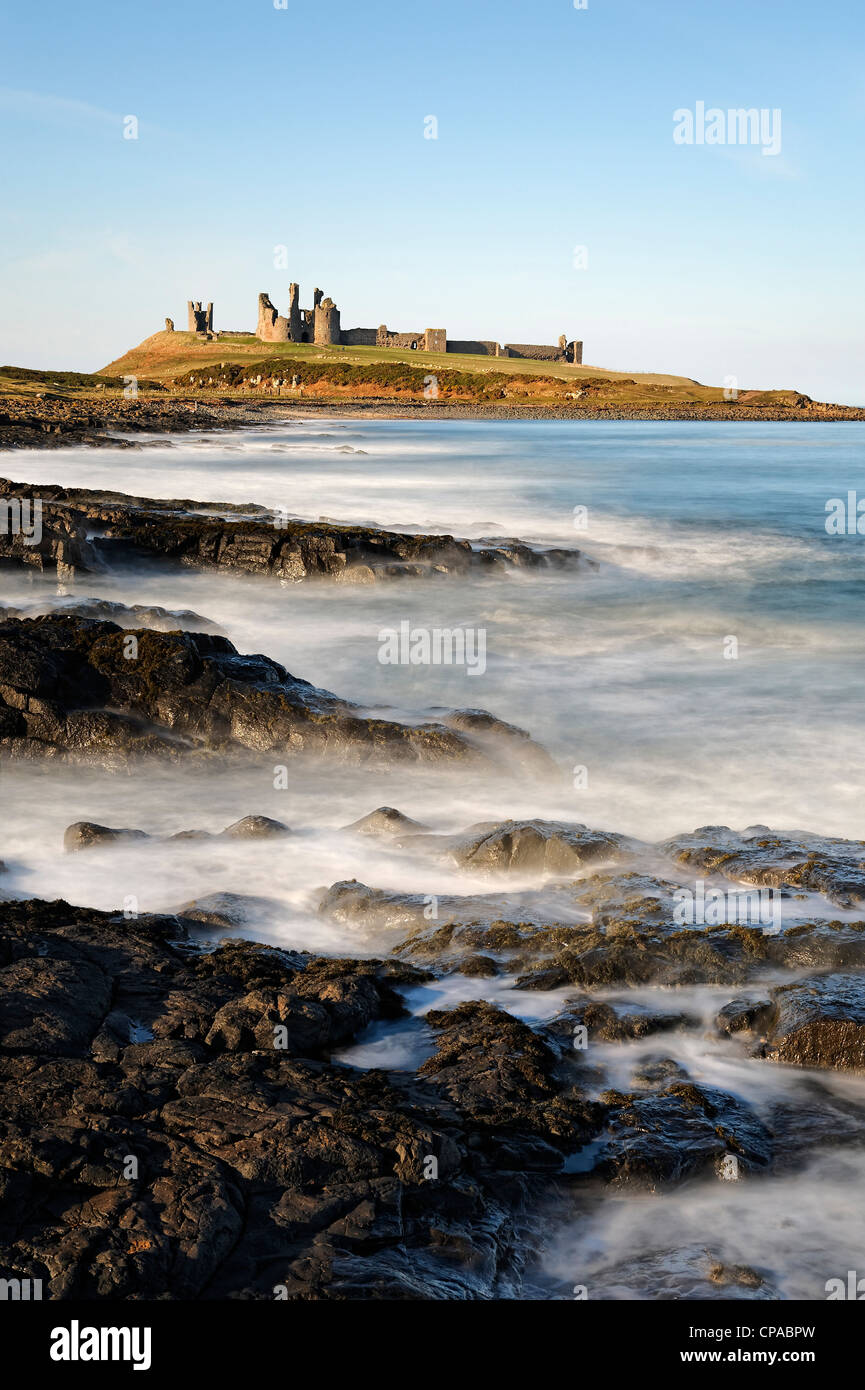 Dunstanburgh Castle by the sea on the Northumberland  Coast Stock Photo