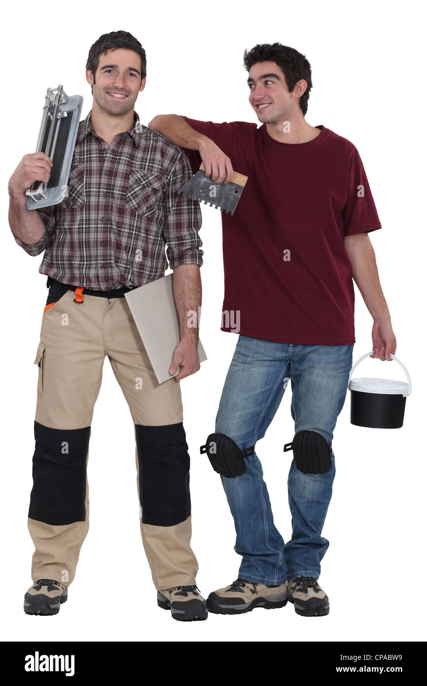 Two male handymen  stood together Stock Photo