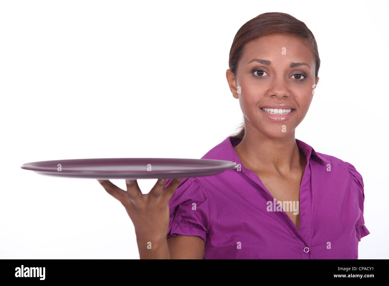 Attractive young waitress holding an empty tray Stock Photo - Alamy