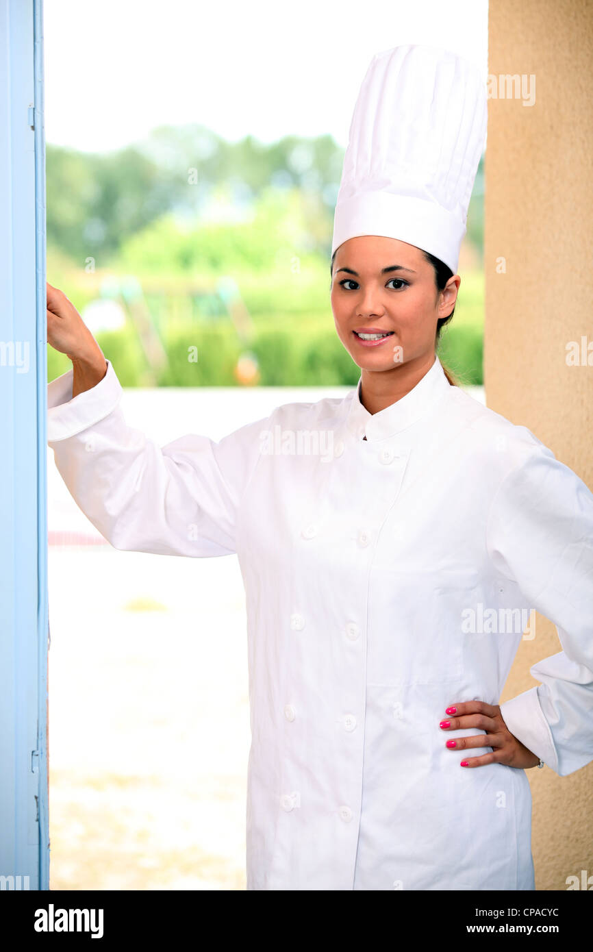 Chef ringing doorbell Stock Photo