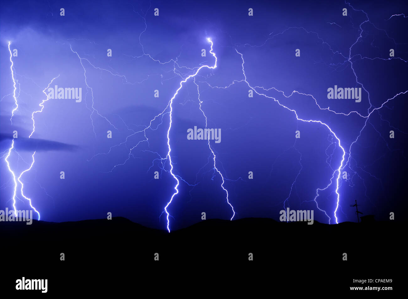 Lightnings in a dark night with blue sky Stock Photo