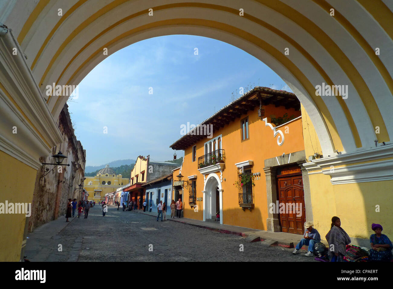 Guatemala Antigua bright colorful cobble stone street Arco de Santa Catalina La Antigua Unesco Site Stock Photo