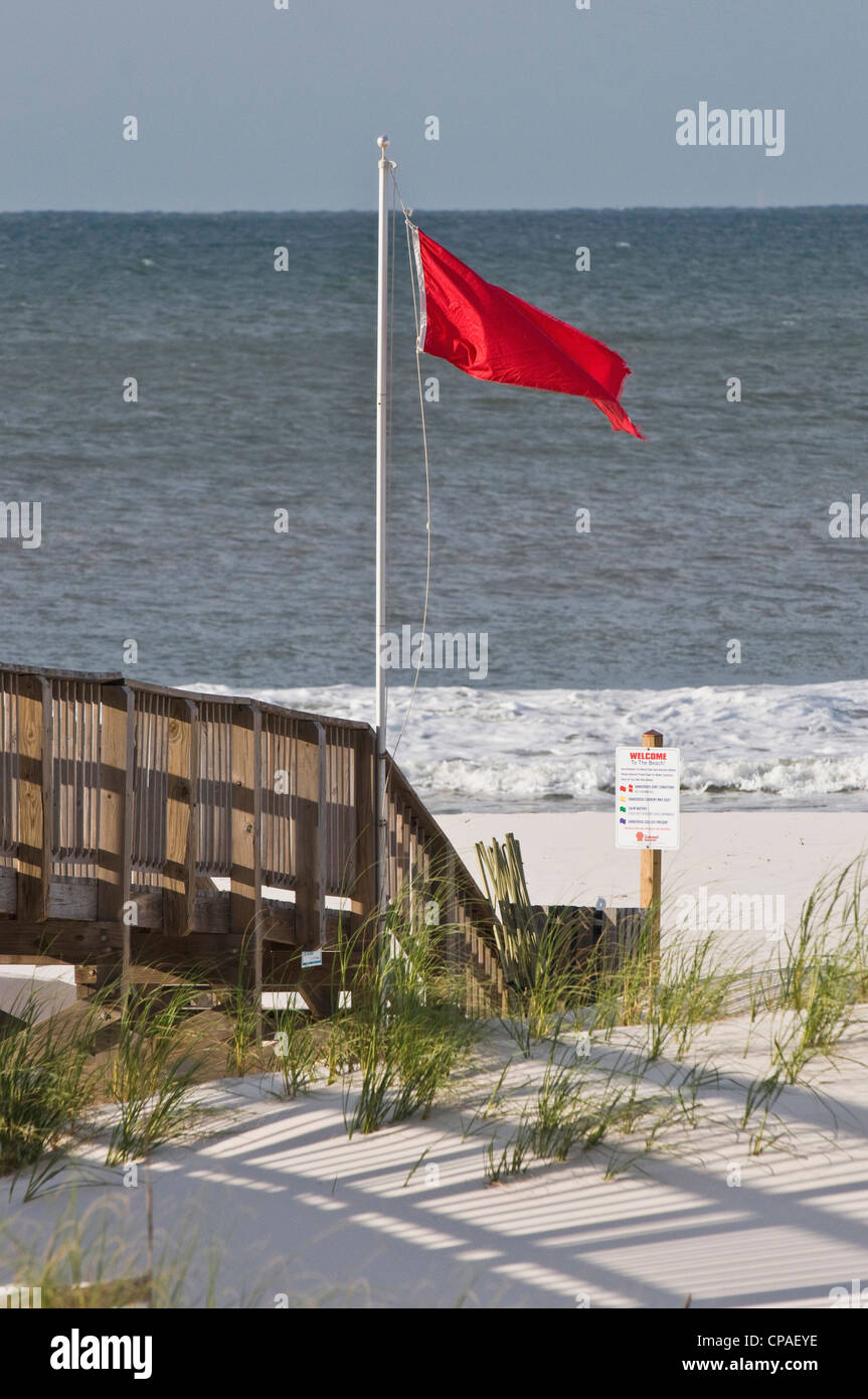 USA, Alabama, Gulf Shores. Red warning flag posted to indicate winds/tides causing dangerous swimming conditions Stock Photo