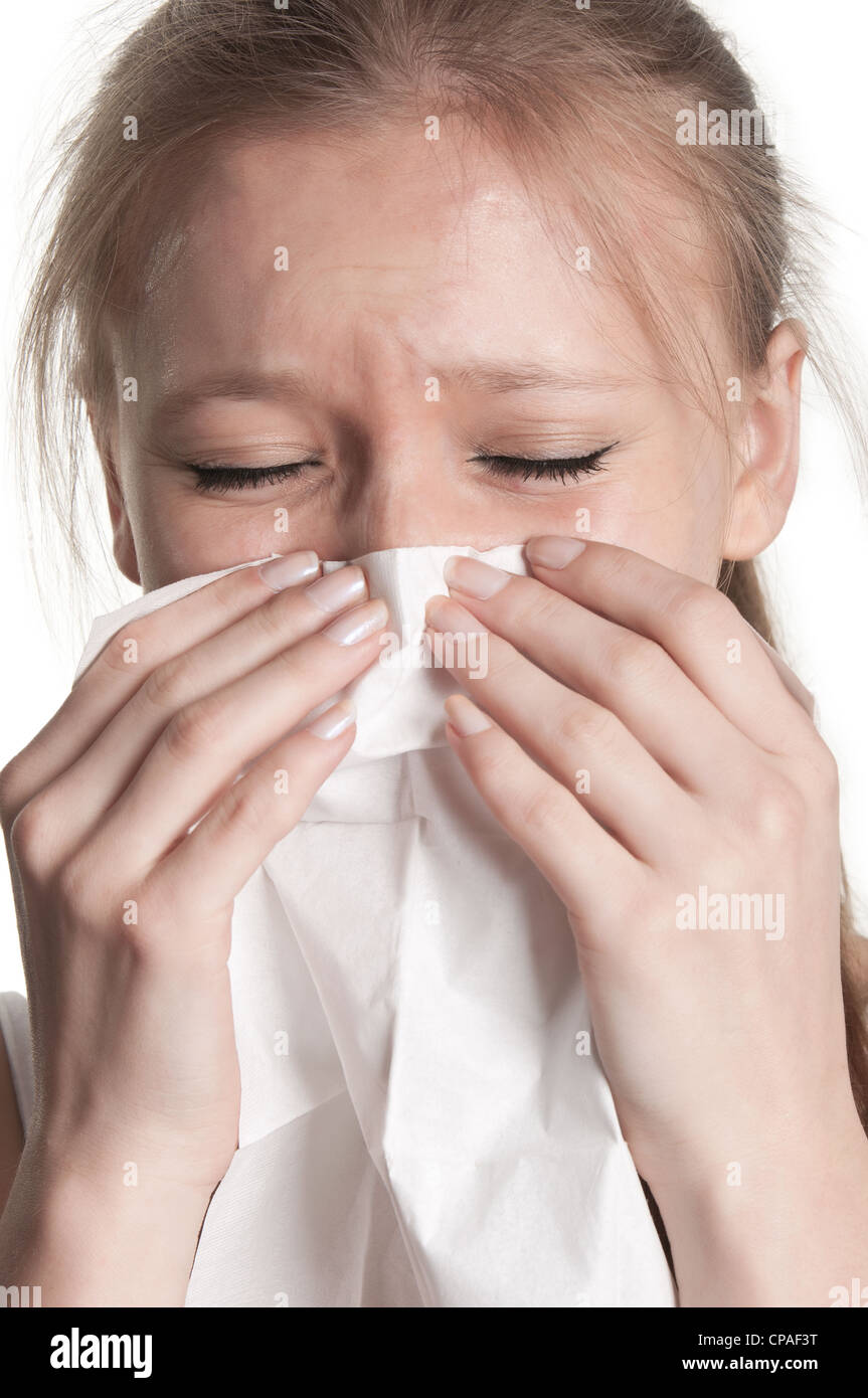 Pale sick woman with a flu, sneezing, in a white background Stock Photo -  Alamy