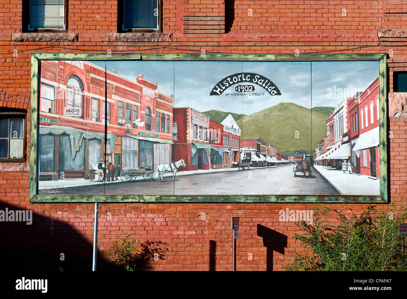 Colorful hand painted mural on side of an old building in historic