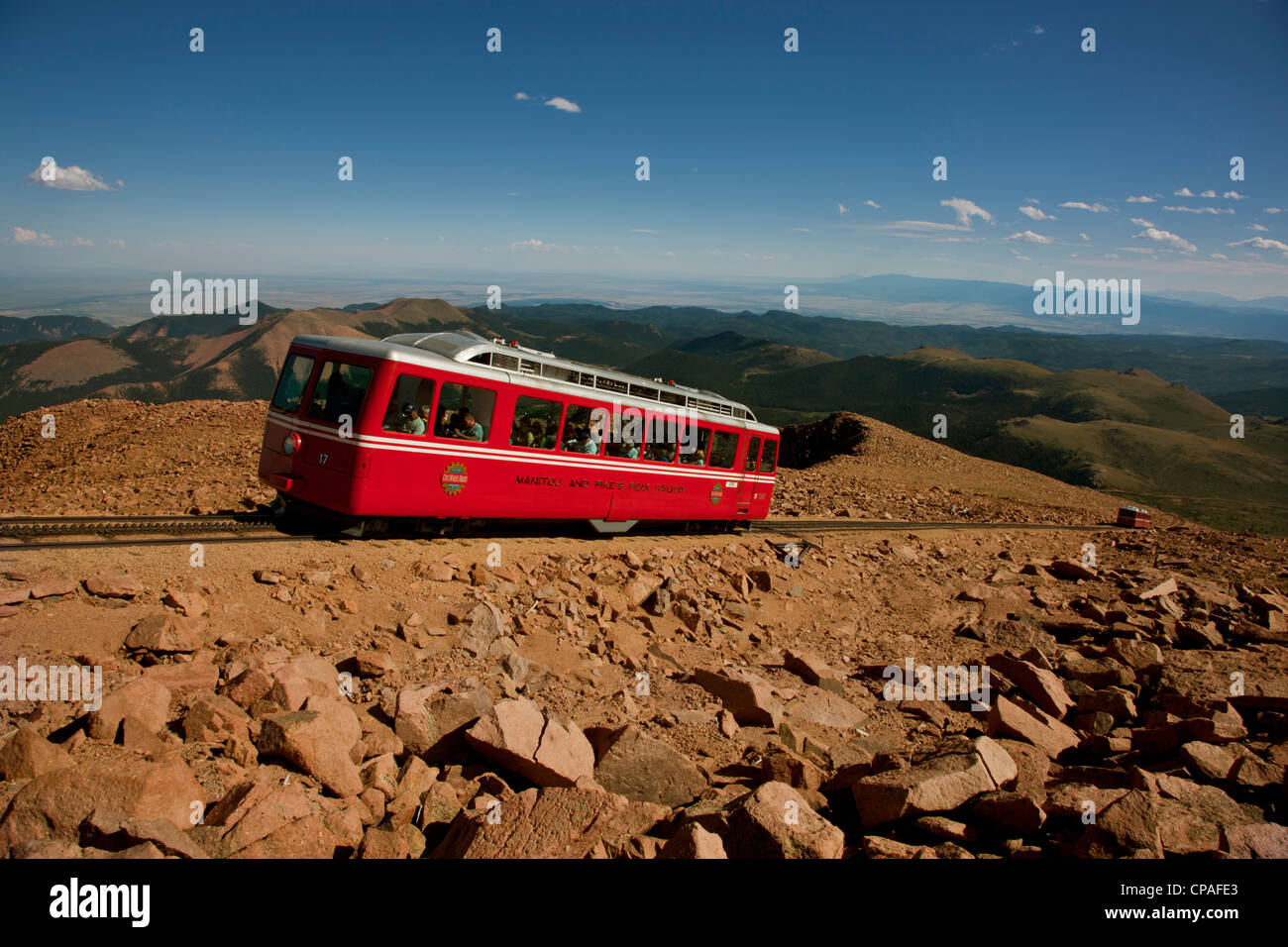 USA, Colorado, Pikes Peak. Red cars of the Manitou and Pikes Peak Cog Railway carrying tourists to the top of Pikes Peak Stock Photo