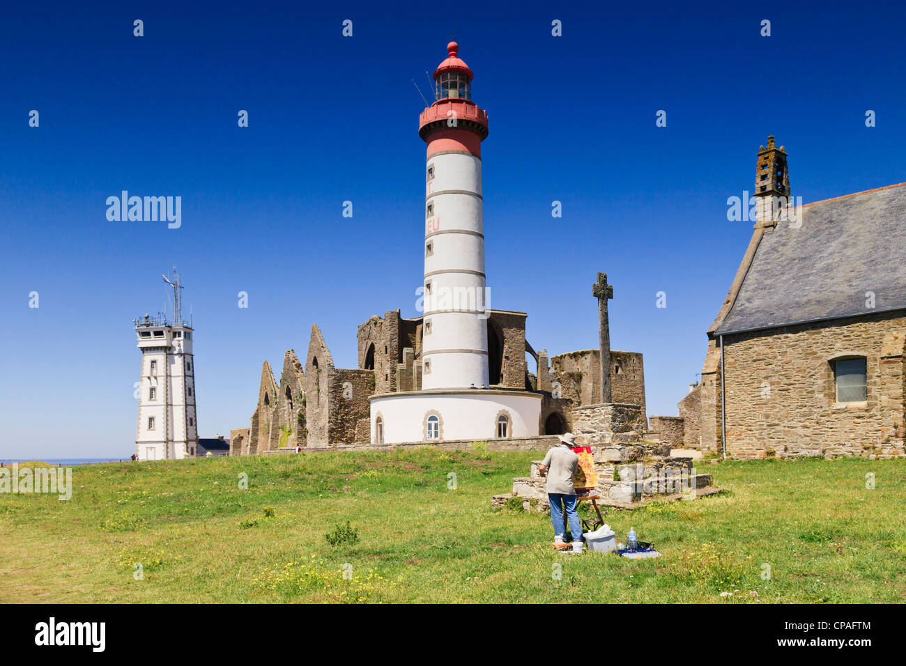 Lighthouse, signal station and ruined abbey on the headland of Pointe Saint-Mathieu in Brittany, France Stock Photo