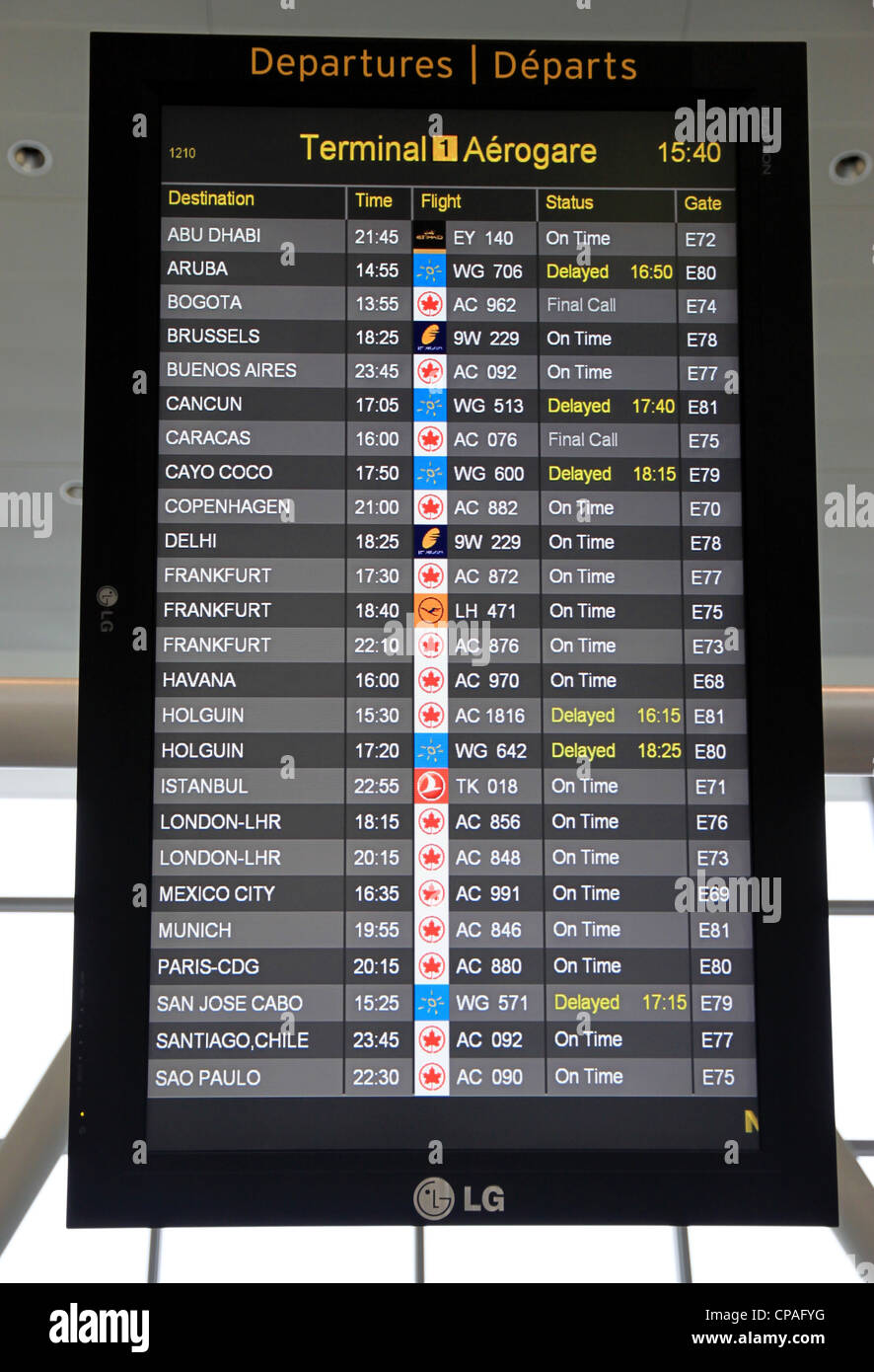 An electronic board showing destinations and departure times Stock Photo