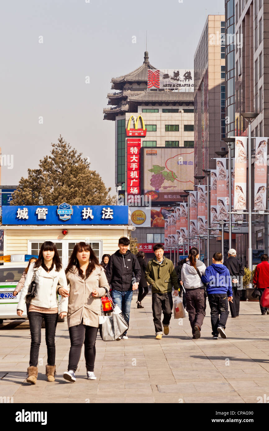 Wanfujing Street, Beijing's most famous shopping street, young shoppers enjoying the day. Stock Photo