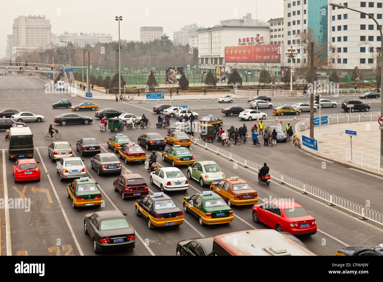 Morning rush hour in Beijing, China, with cars, bikes and the pollution for which the city is infamous Stock Photo