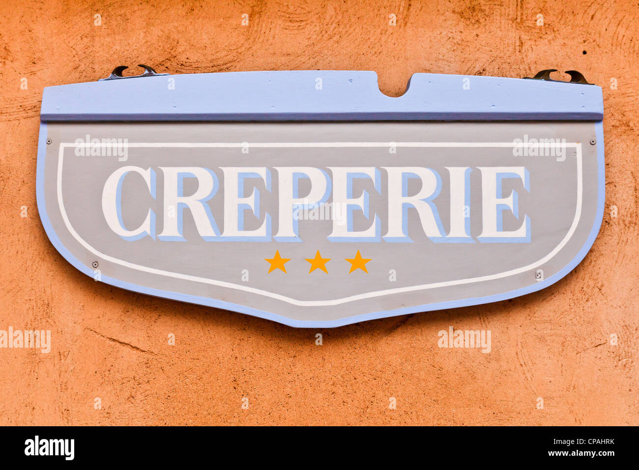 Sign on wall of a creperie, a restaurant specialising in crepes, in the old town of Concarneau in Brittany, France Stock Photo
