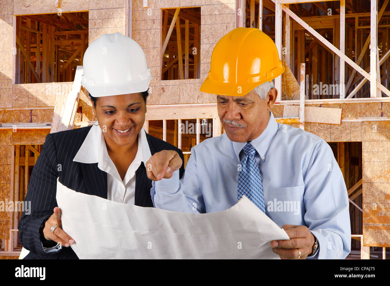 Construction workers working on a job together Stock Photo