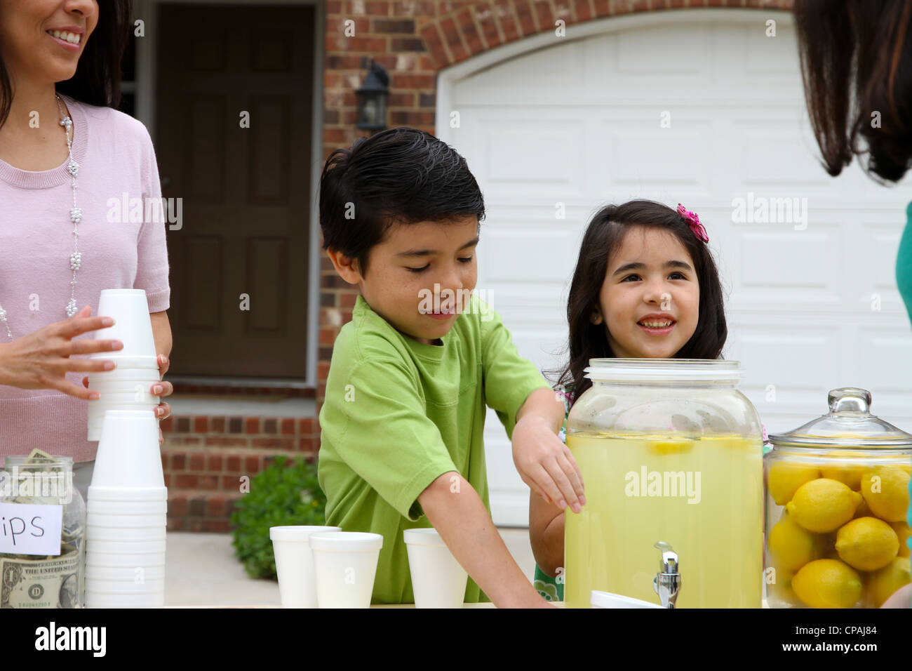 Children selling lemonade in front of their home Stock Photo Alamy