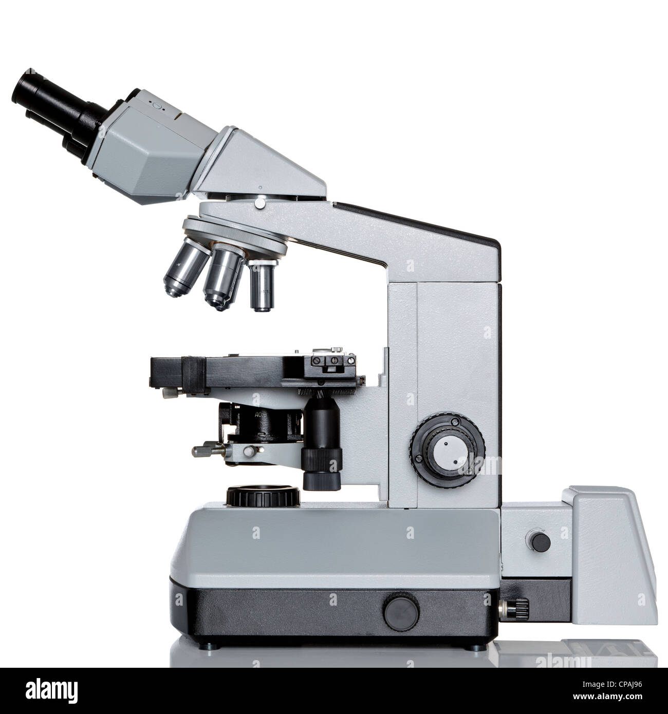 Photo of a professional ocular laboratory microscope with stereo eyepiece isolated on a white background. Stock Photo