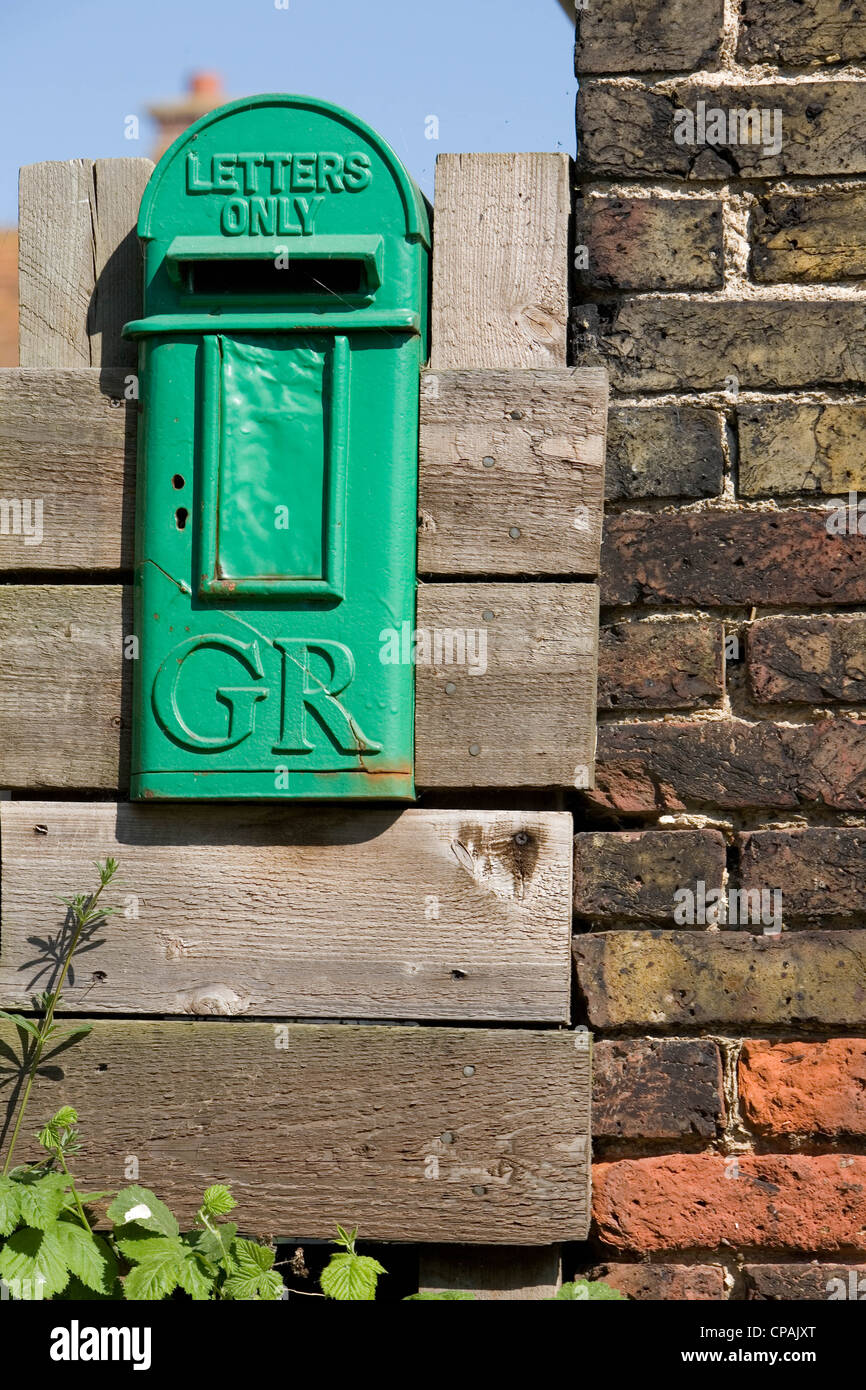 Green GR post box, Swale, Kent, England, UK Stock Photo