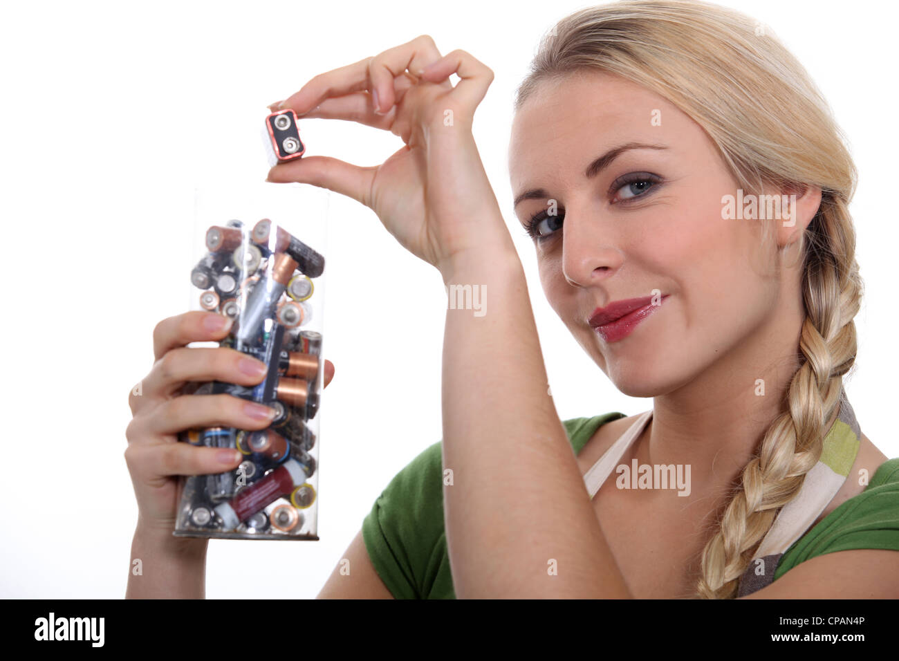 Blond woman recycling used batteries Stock Photo