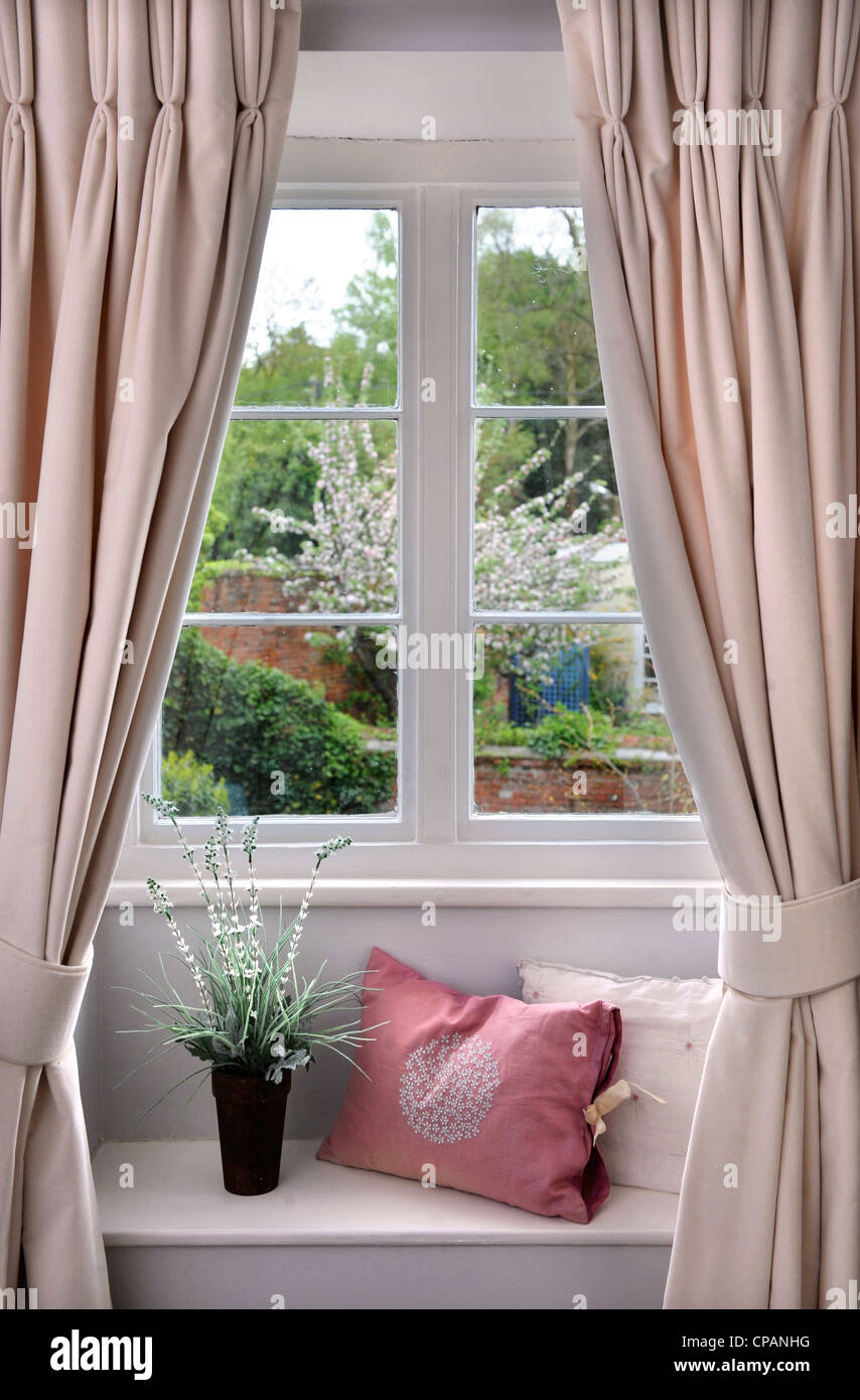 Window seat in a cottage bedroom UK Stock Photo