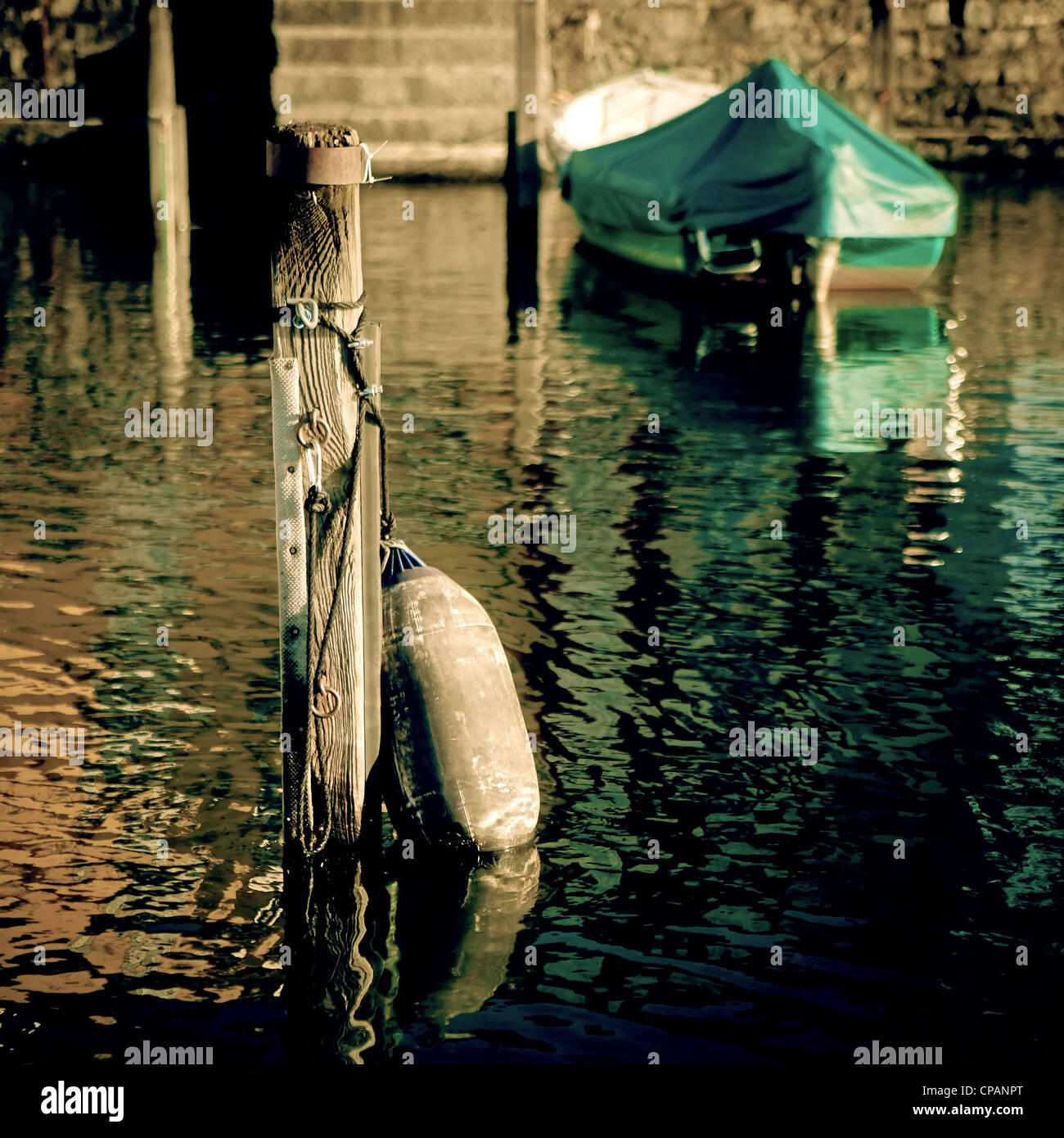 pile mooring and fender in an old port Stock Photo