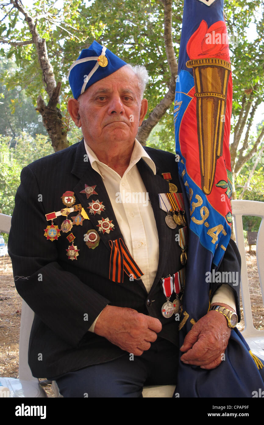 A soviet Jewish World War II veteran with medals pinned in his suit coat during ceremony marking the Allied Victory over Nazi Germany in Israel Stock Photo