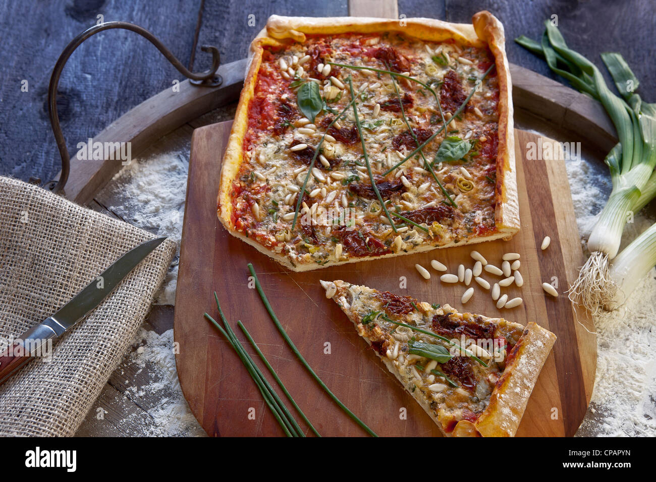 Pizza topped with cottage cheese and herbs Stock Photo