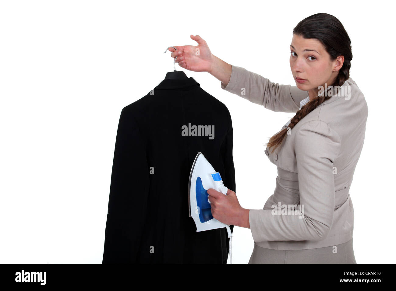 Woman ironing a suit Stock Photo Alamy