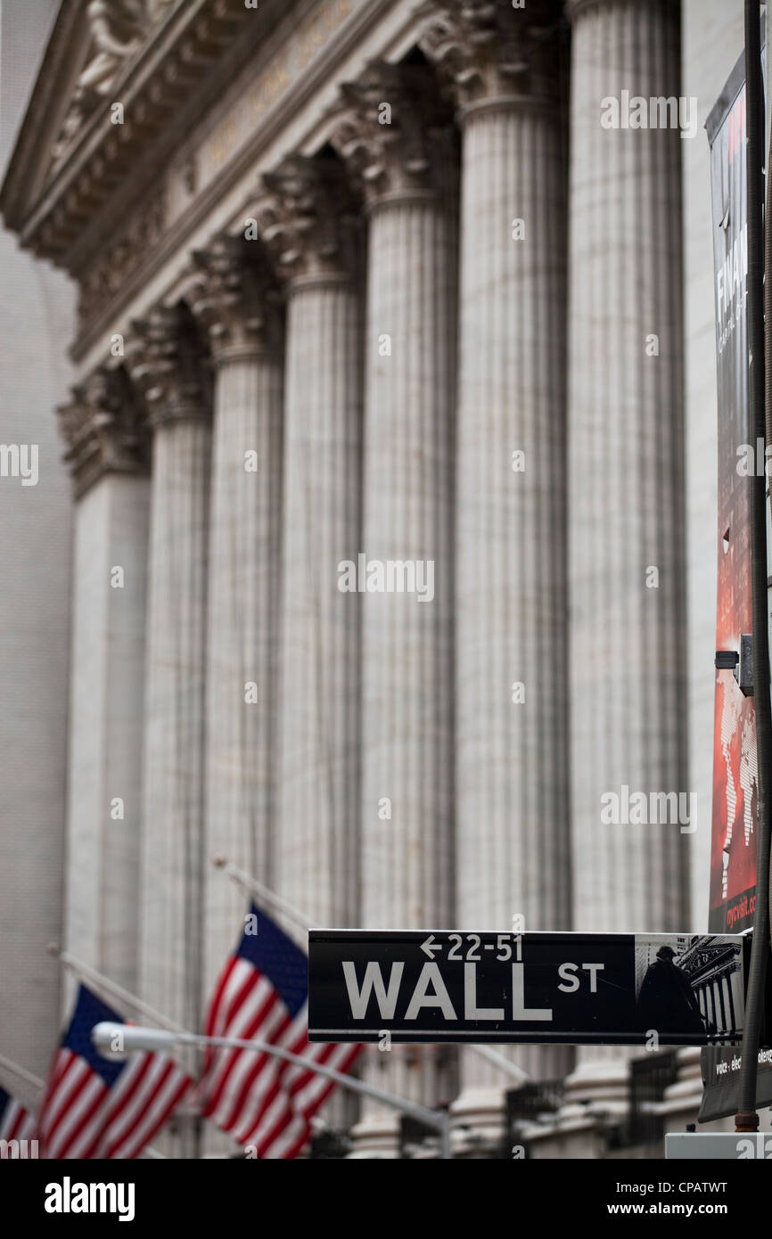 Wall Street sign in front of New York Stock Exchange in Manhattan, New York City Stock Photo