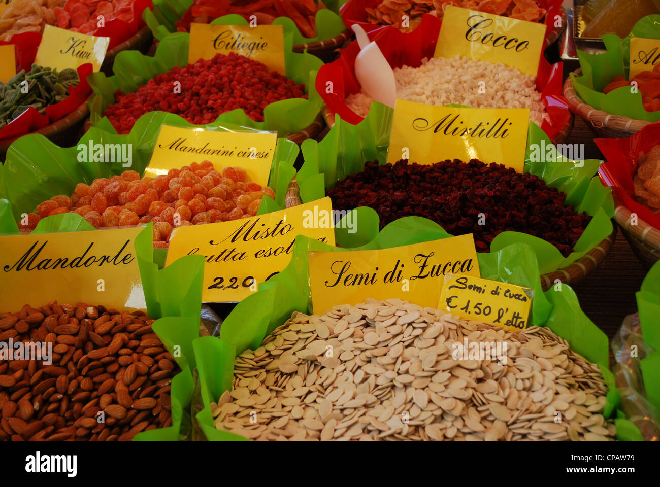 Various edible seeds and fruits on sale at the market, Italy Stock Photo