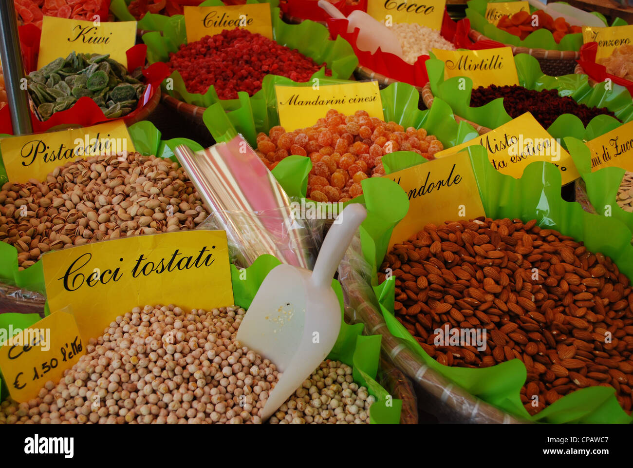 Various edible seeds and fruits on sale at the market, Italy Stock