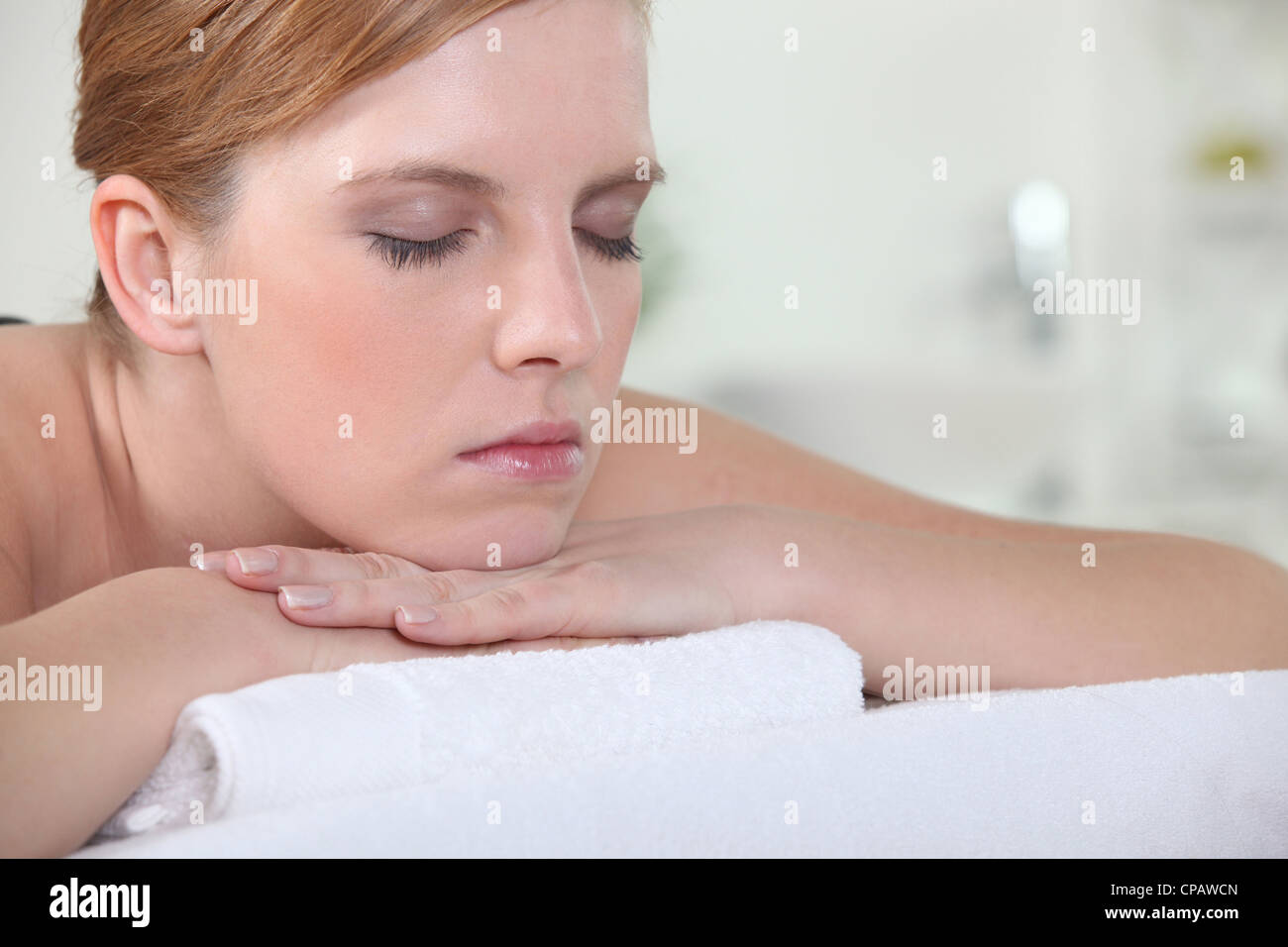 Woman with her eyes closed during a back massage Stock Photo Alamy