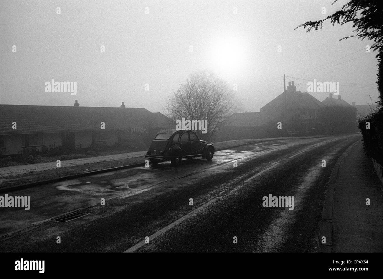 A Citroen 2CV on a cold morning in an English village Stock Photo