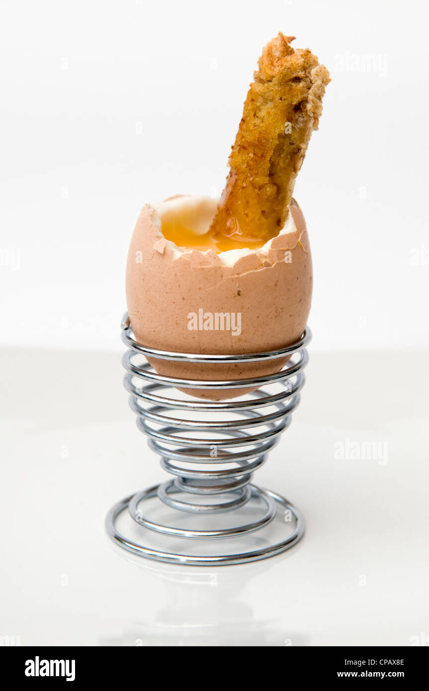 Soliders Toast Soft boiled egg and soldiers toast in metal egg cup on white background ...