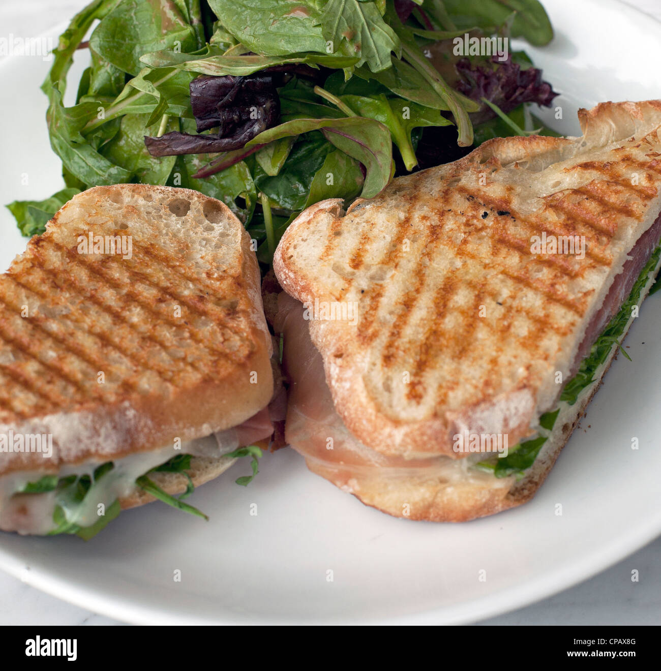 Lunch is panini and salad today. Stock Photo
