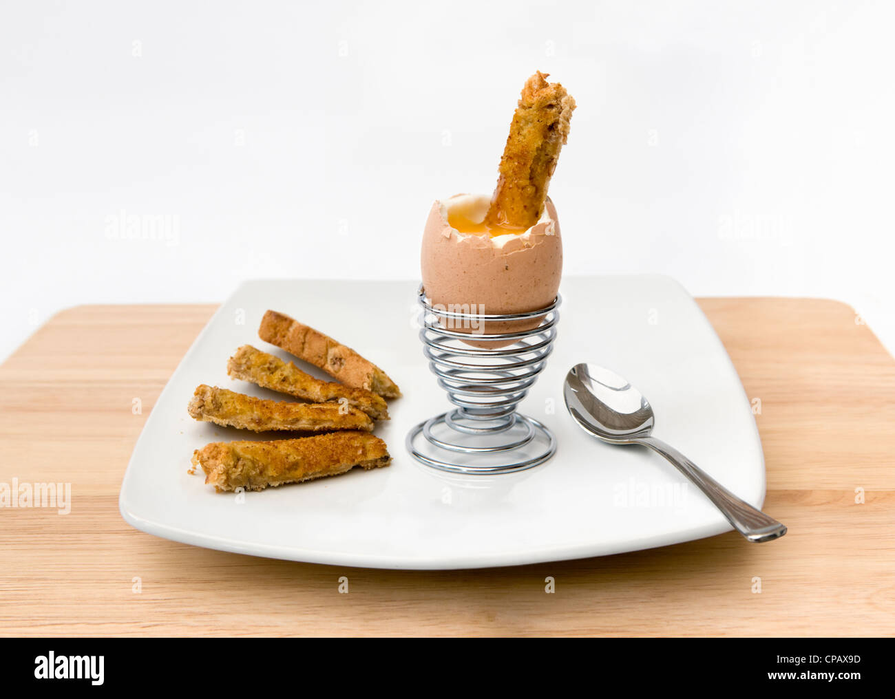 Soliders Toast Soft boiled egg and soldiers toast in metal egg cup on white background ...