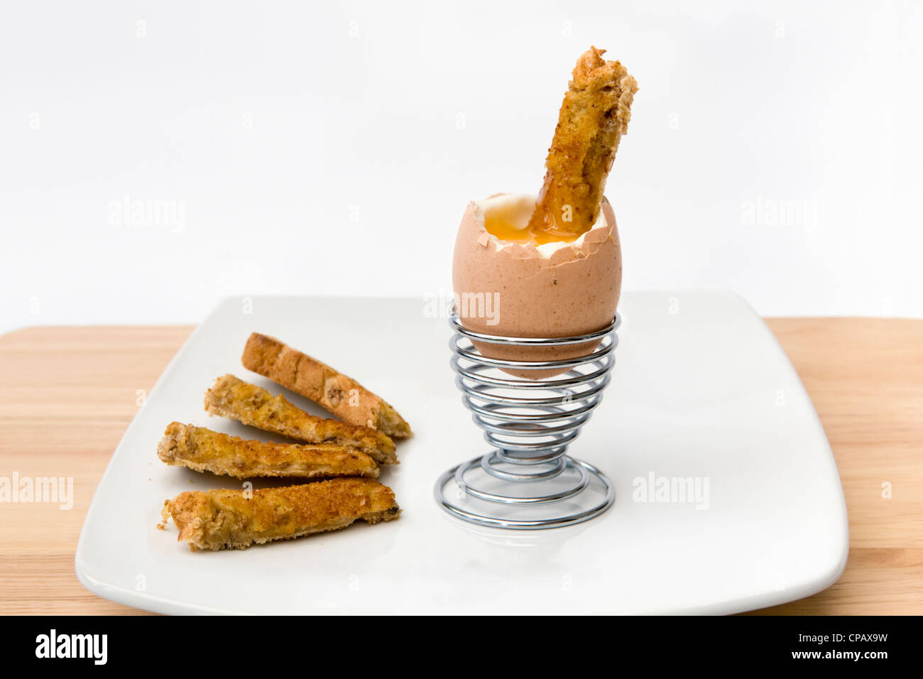 Soliders Toast Soft boiled egg and soldiers toast in metal egg cup on white background ...