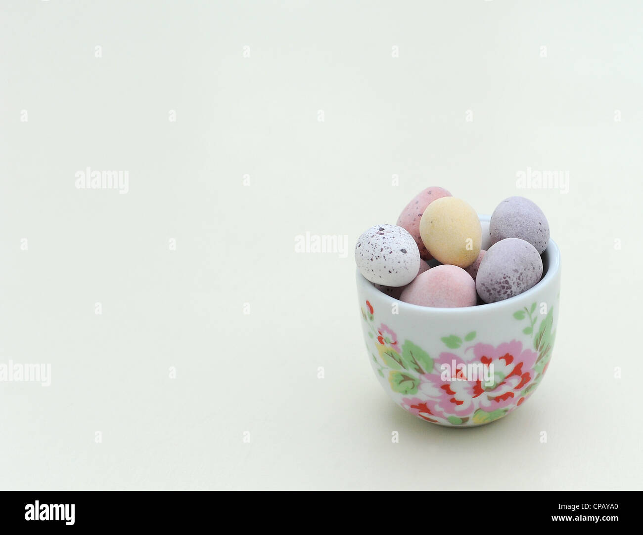 Cadburys Mini Eggs in a Flowery Egg Cup Stock Photo