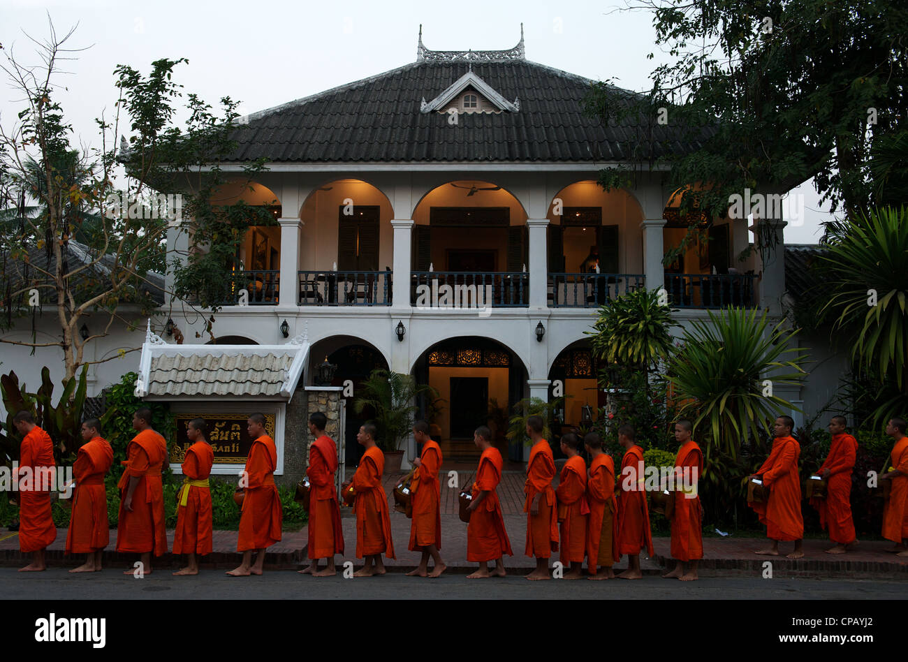 Novice monks collect alms every morning at dawn, Luang Prabang, Mekong River, Laos Stock Photo